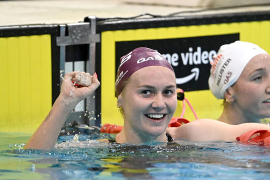 Ariarne Titmus celebrates her 3:56.40 World 400m free record, the first solo global standard of her career, in Adelaide - by Delly Carr, courtesy of Swimming Australia