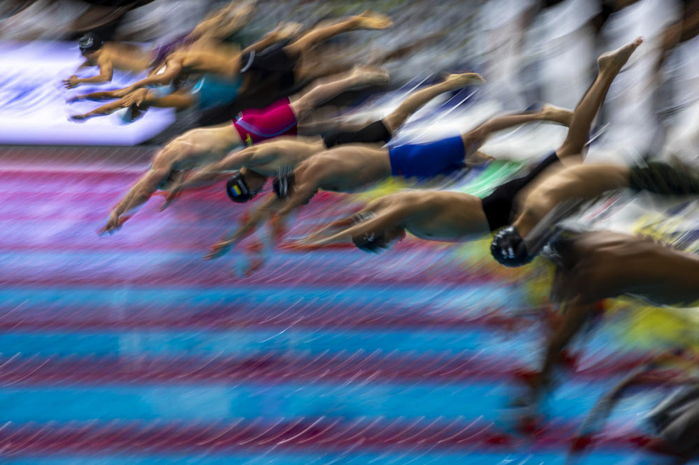 Swimmers compete in the Men's 50m Breaststroke Heat 4 during the swimming events of the 19th Fina World Championships held at the Duna Arena in Budapest, Hungary, Monday, June 20, 2022.