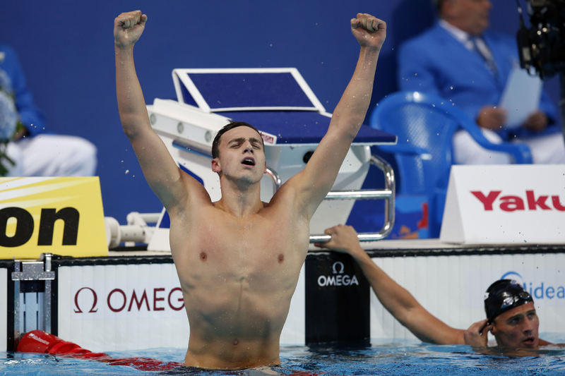 James Guy of Great Britain jubilates after winning the men's 200m Freestyle Final while Ryan Lochte (R) of the United States of America (USA) finishes 4th during the FINA Swimming World Championships at Kazan arena in Kazan, Russia, 4 August 2015.