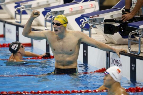 Mack ORTON of Australia jubilates after winning in the men's 400m Freestyle Final, while Yang SUN of China (bottom) finishes 2nd